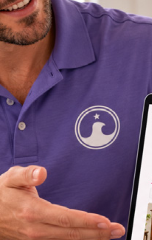 Close-up of the Aether emblem on a purple team polo shirt